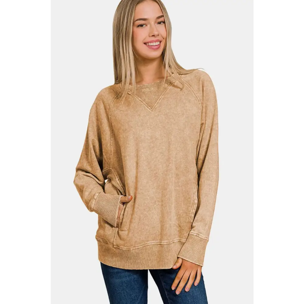 Beige pocketed round neck sweatshirt with ribbed cuffs and hem featuring v-neckline and front pockets
