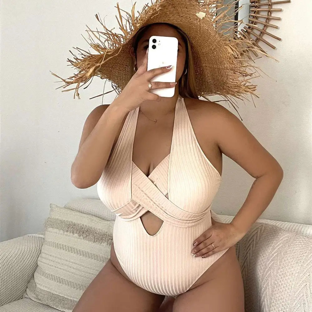 Beige ribbed one-piece swimsuit with a halter neck front cross-over design and cutout detail for plus size fashion