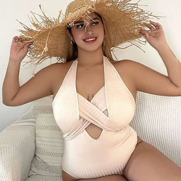 Beige ribbed one-piece swimsuit with halter neck and front cross-over design in plus size fashion style