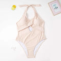 Beige ribbed one-piece swimsuit with halter neck, front cross straps, and keyhole cutout for plus size fashion