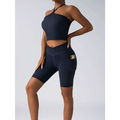 Navy blue high waist workout bike shorts with side pocket paired with beige ribbed wide shoulder straps set