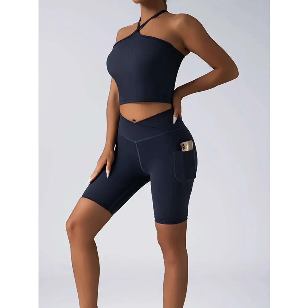 Navy blue high waist workout bike shorts with side pocket paired with beige ribbed wide shoulder straps set