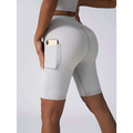 Light gray high waist workout bike shorts with textured fabric and side pocket in beige ribbed set