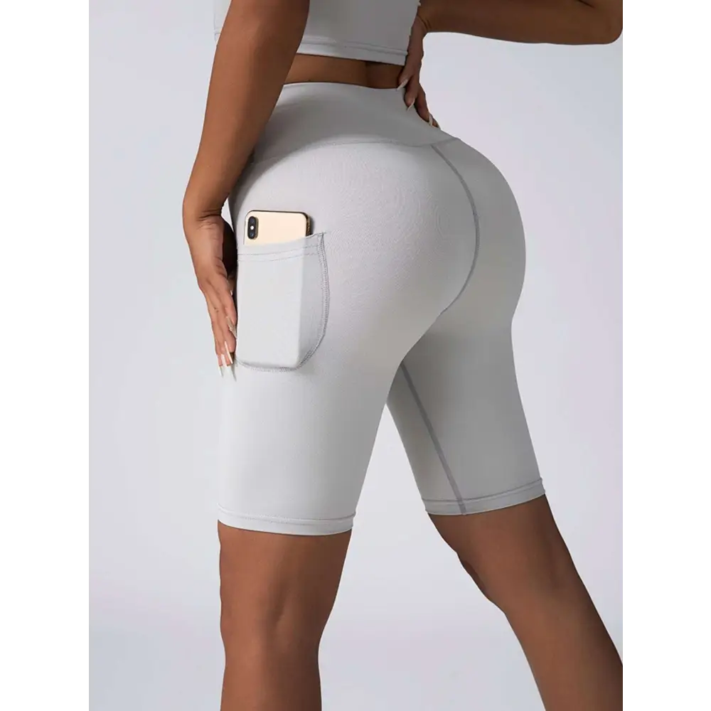 Light gray high waist workout bike shorts with textured fabric and side pocket in beige ribbed set