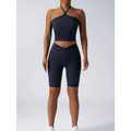 Navy blue high waist biker shorts with sleek form fitting design and subtle side seam detailing for workout use