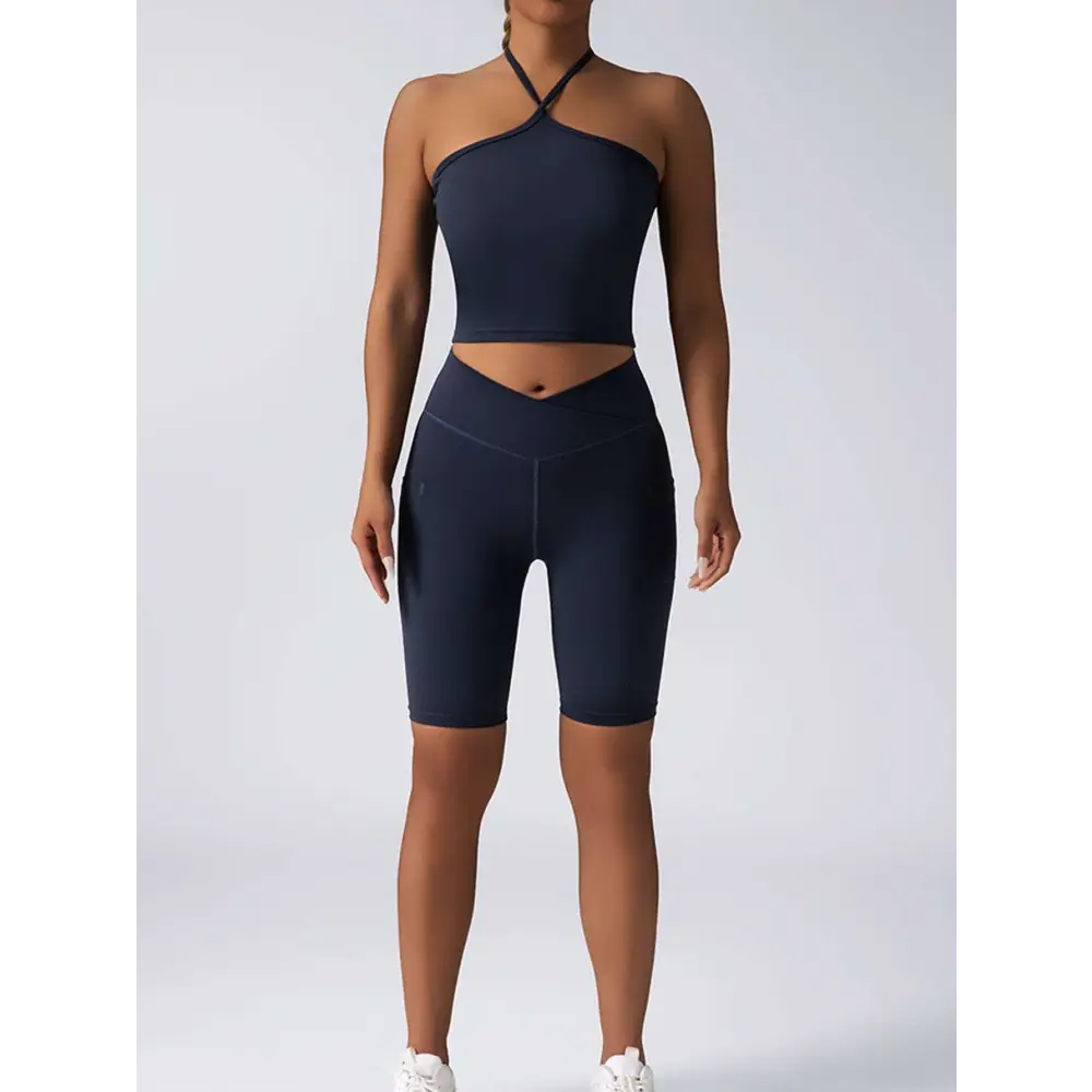 Navy blue high waist biker shorts with sleek form fitting design and subtle side seam detailing for workout use