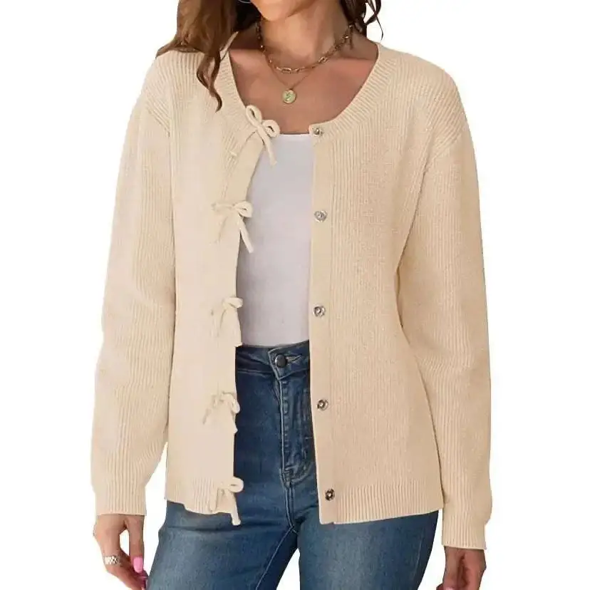 Beige ribbed knit buttoned cardigan for women with decorative lace-up ties and bows along the front