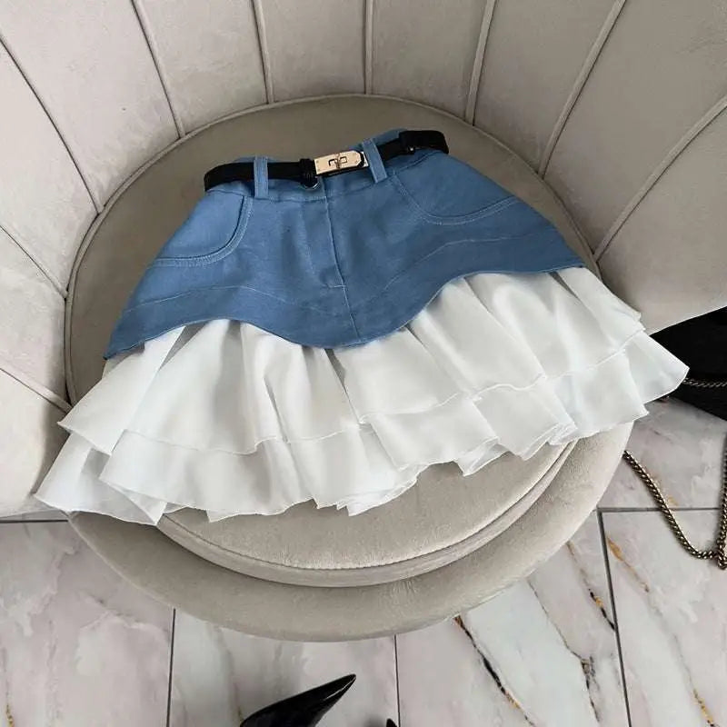 Beige two tone waist tiered skirt in denim and white with ruffled high waist and black belt with gold buckle