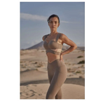 Beige yoga pants and sport coat fitness set featuring a structured bra top and high-waisted leggings for workout