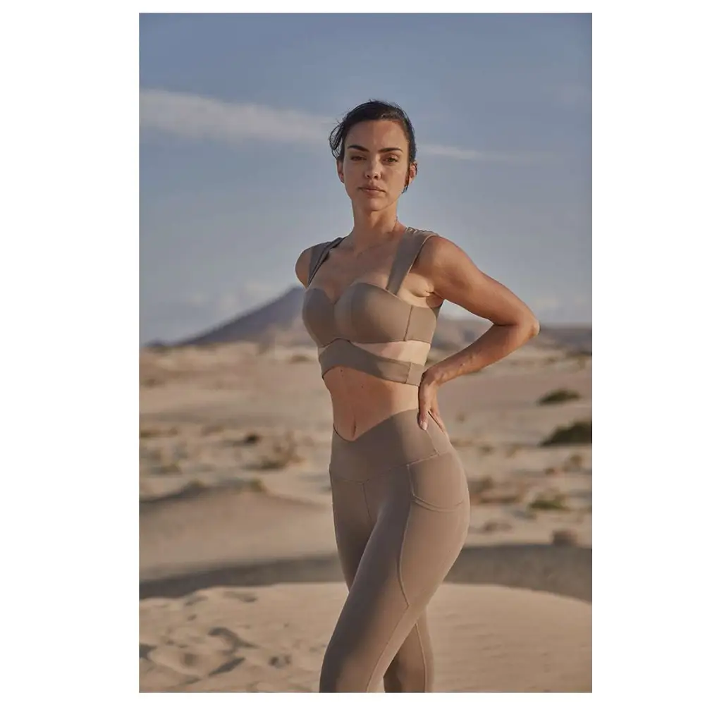Beige yoga pants and sport coat fitness set featuring a structured bra top and high-waisted leggings for workout