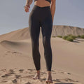 Black high-waisted leggings with sleek design and side pockets paired with beige yoga pants sport coat fitness set