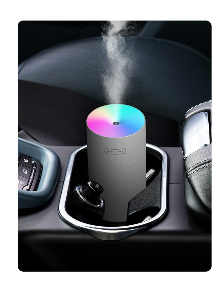 a sleek white cylindrical second generation colorful cup humidifier with a rainbow-colored top emitting mist designed for usb use
