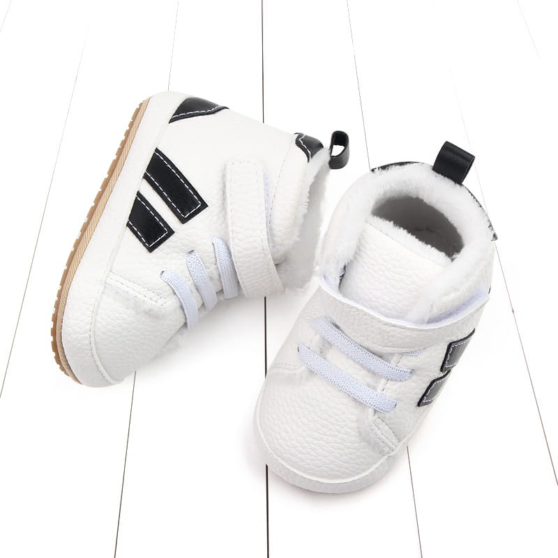 white baby shoes with black stripes featuring plush lined sports soft-sole cotton construction and soft fleece lining
