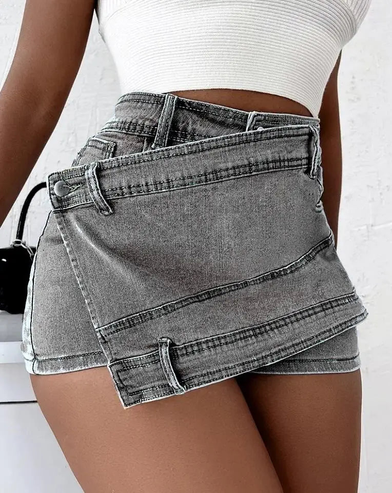 A stylish gray denim mini skirt with unique asymmetrical design and visible stitching details featuring y2k street vintage and street vintage denim elements.
