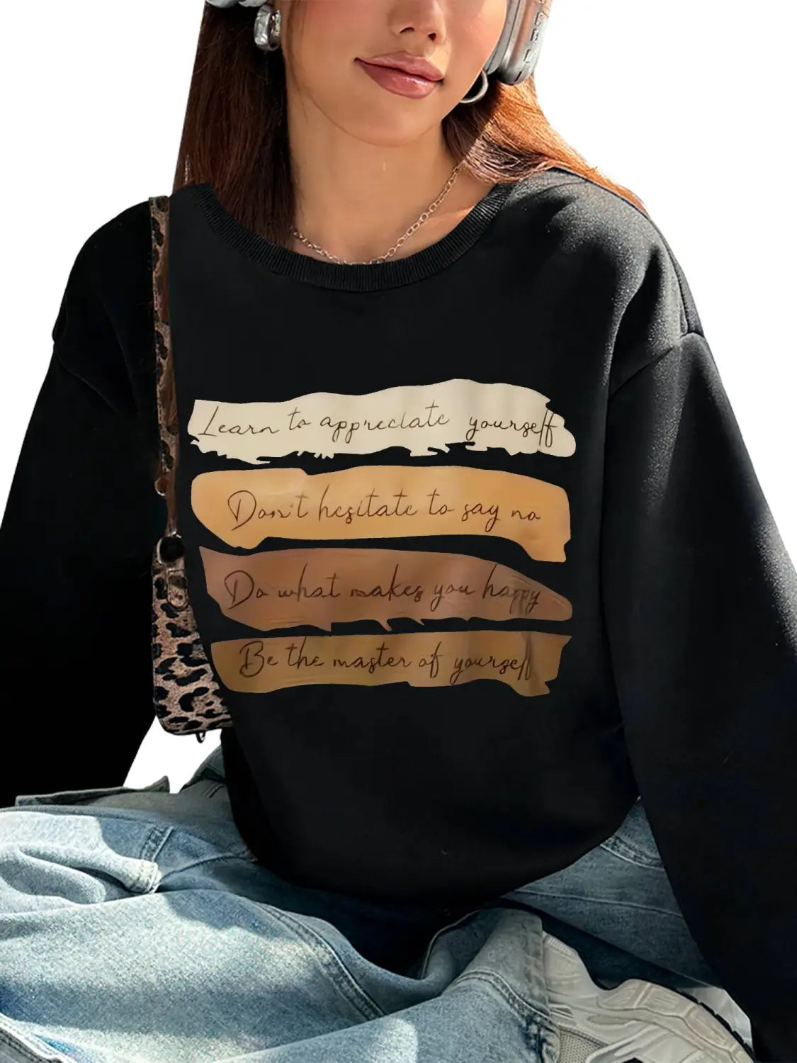 black long sleeve sweatshirt with motivational quotes printed in beige and gold on the front ideal for daily wear in a solid colour design.