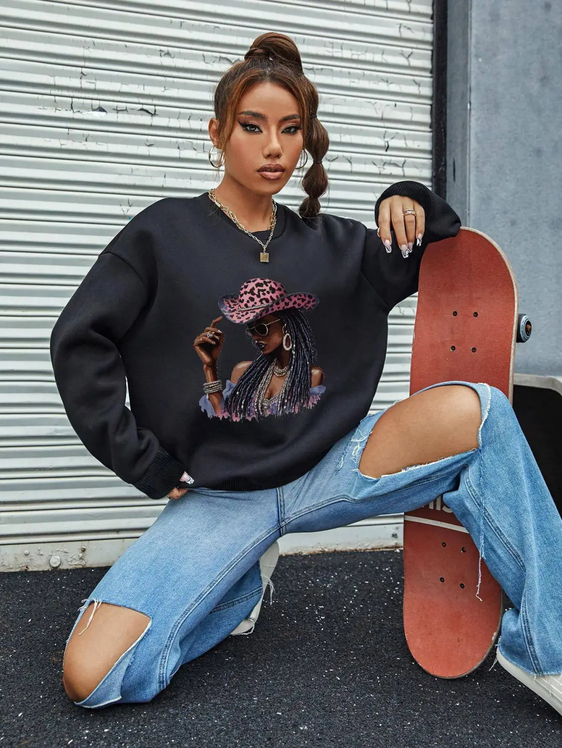 black long sleeve sweatshirt featuring a graphic of a woman wearing a pink leopard print hat and sunglasses