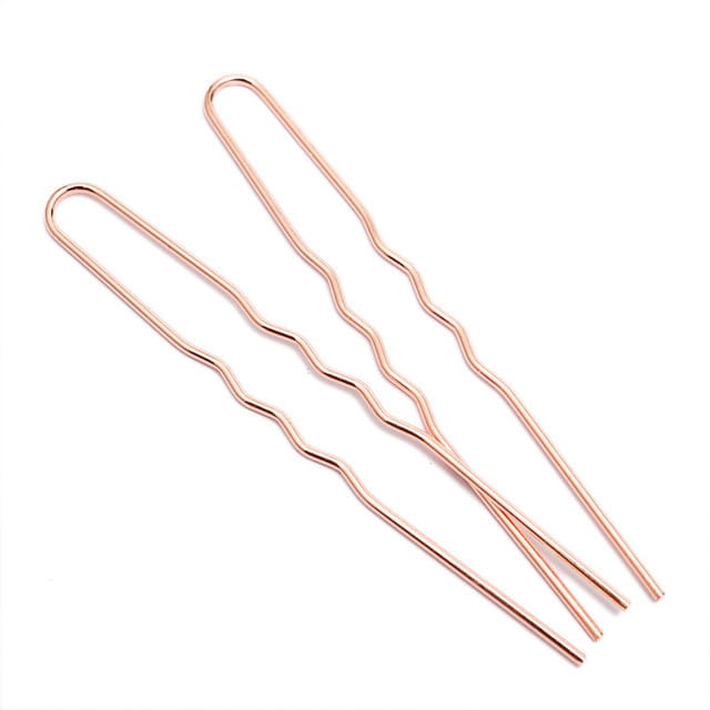Two rose gold wavy hair pins with a sleek metallic finish made of durable metal for diy hair accessories and hair accessories material.