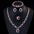 Rose gold jewelry four-piece suit with deep blue oval stones and clear crystals by big brand retro zircon