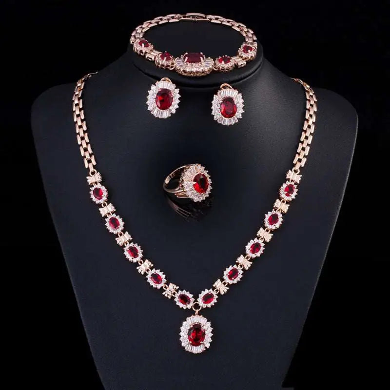 Elegant rose gold jewelry four-piece suit with brand retro zircon red gemstones and clear crystals on black mannequin