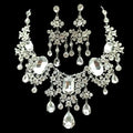 A big crystal bridal silver choker necklace and matching earrings with cascading teardrop and oval-cut rhinestones