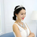 A sparkling silver tiara with intricate crystal embellishments complements the big crystal bridal rhinestone set