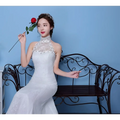 White lace mermaid wedding gown with beaded neckline and halter top showcasing size waist details