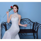 White lace mermaid wedding gown with beaded neckline and halter top showcasing size waist details
