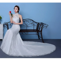 White lace mermaid wedding gown with high neckline and beaded embellishments showcasing size waist details