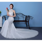White lace mermaid wedding gown with high neckline and beaded embellishments showcasing size waist details