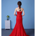 Vibrant red lace mermaid gown with strapless back and intricate corset-style lacing highlighting size waist features