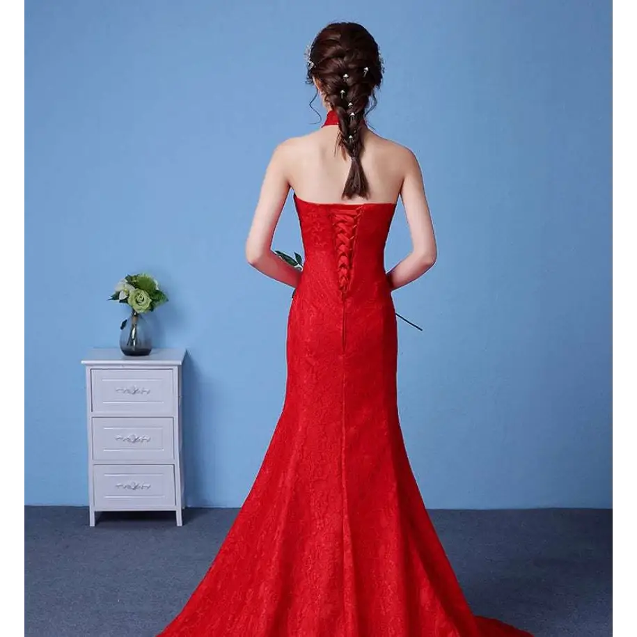 Vibrant red lace mermaid gown with strapless back and intricate corset-style lacing highlighting size waist features