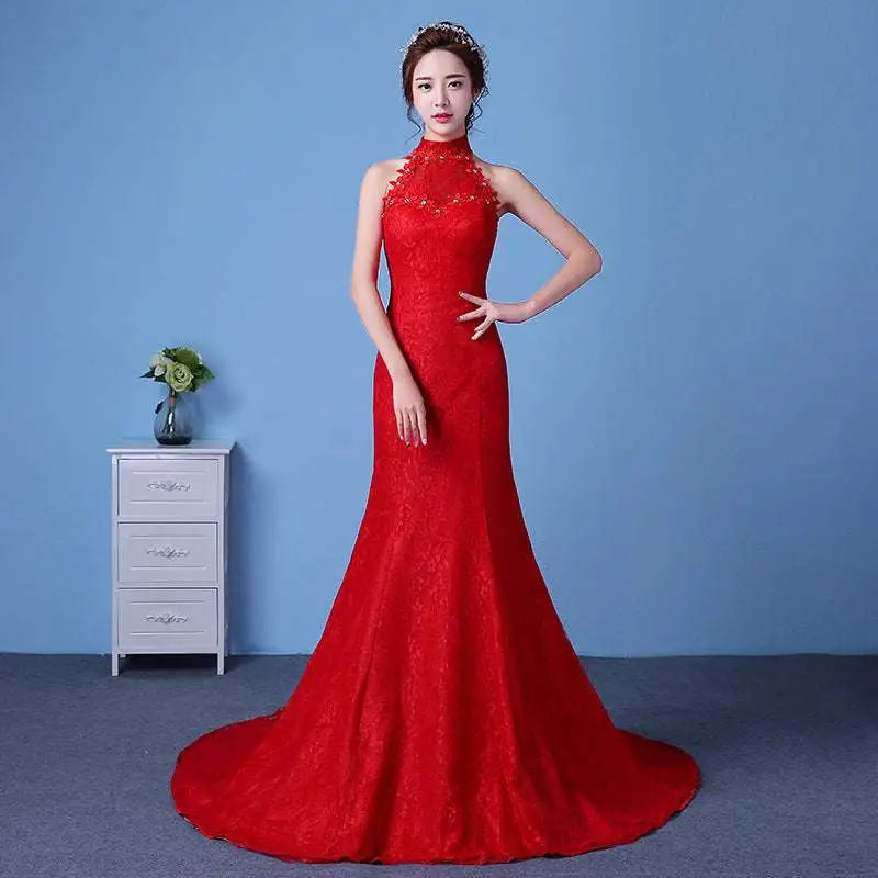 A vibrant red lace mermaid wedding dress with a high neckline and intricate floral embroidery showcasing size waist details