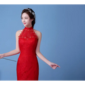 A vibrant red lace mermaid wedding dress with a high neckline and delicate floral embellishments highlights the size waist