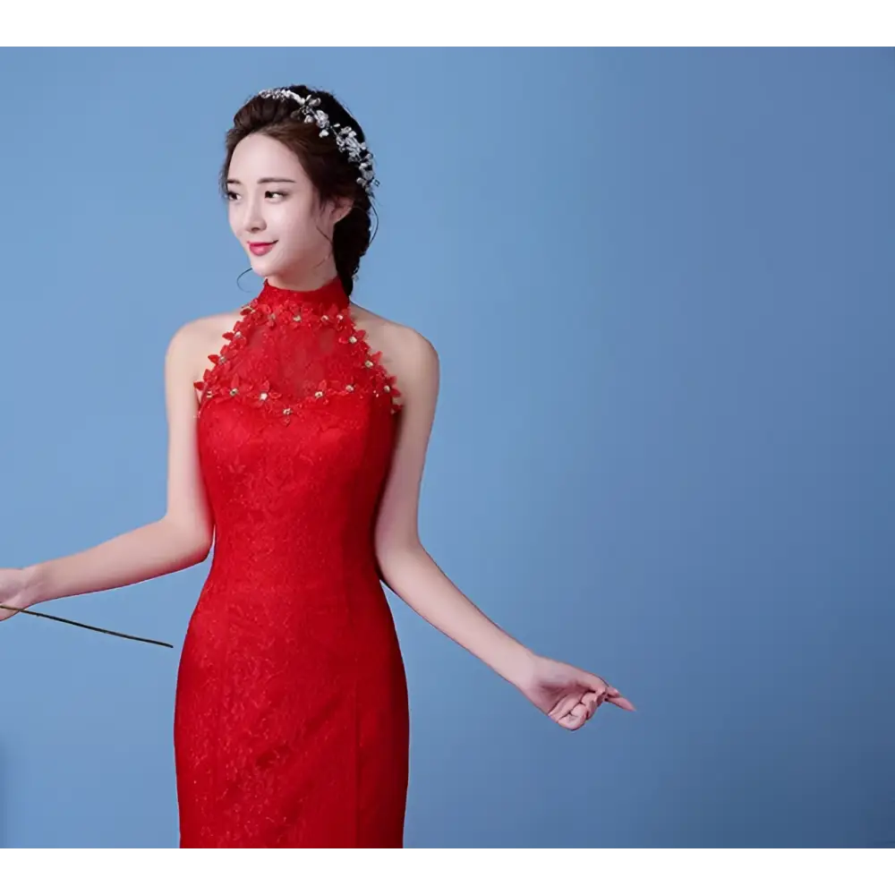 A vibrant red lace mermaid wedding dress with a high neckline and delicate floral embellishments highlights the size waist