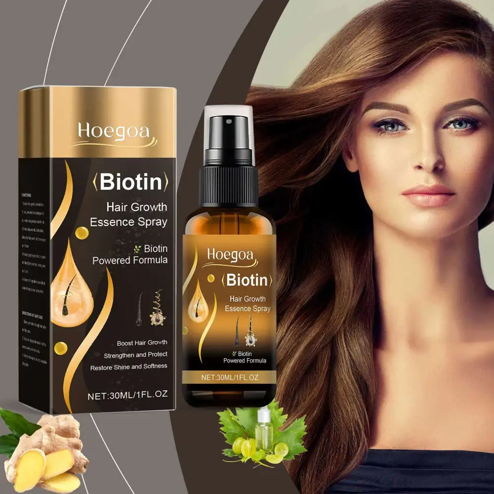Hoegoa biotin hair growth essence spray in an amber glass bottle with black spray nozzle next to gold and black packaging