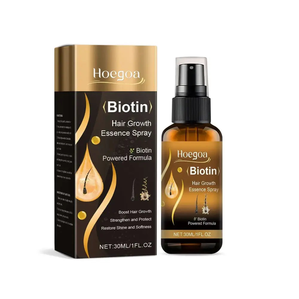 Hoegoa biotin hair growth essence spray in an amber glass bottle with black spray nozzle and gold dark brown packaging