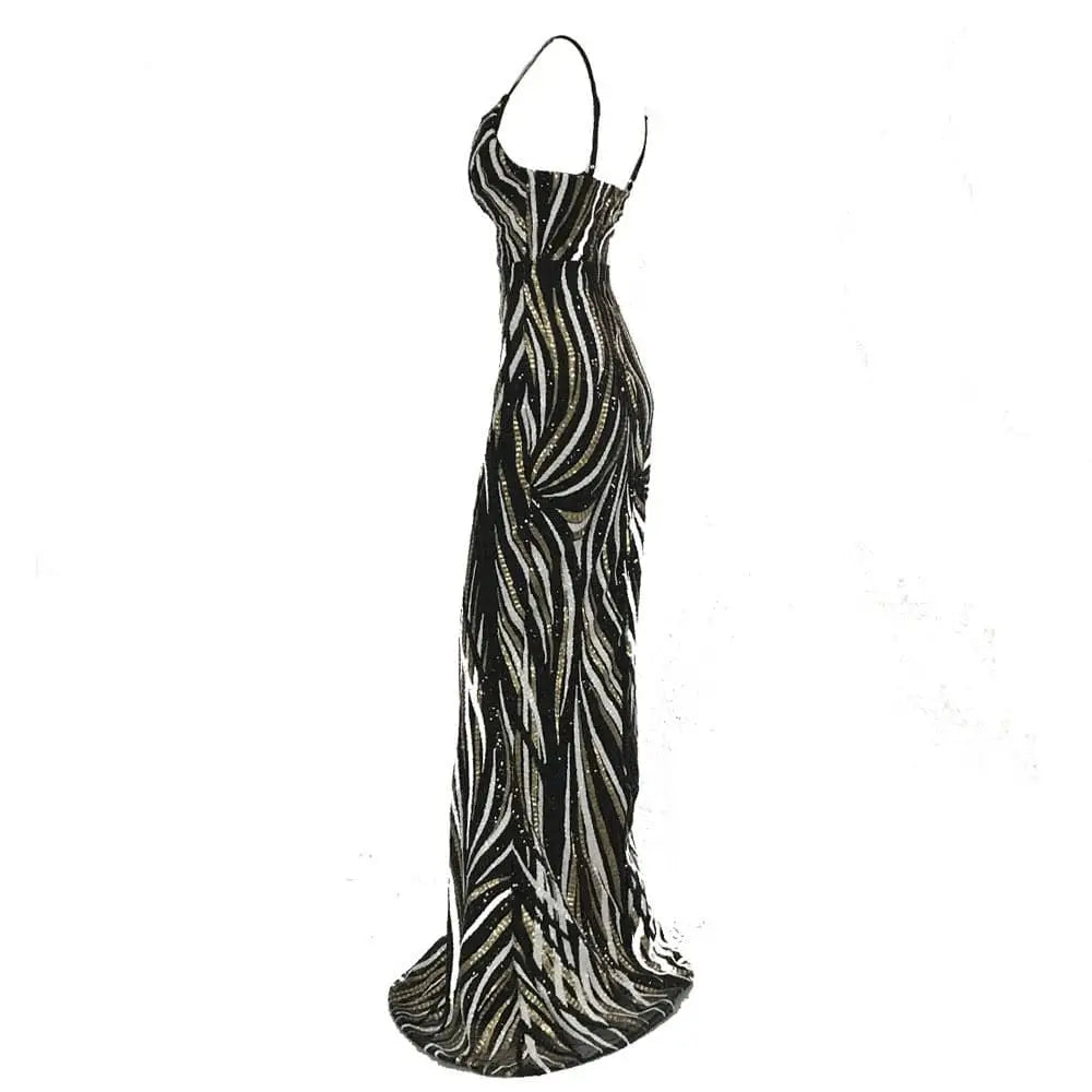 Black and silver sequined mermaid evening dress with fitted silhouette, thin straps, and elegant flowing skirt