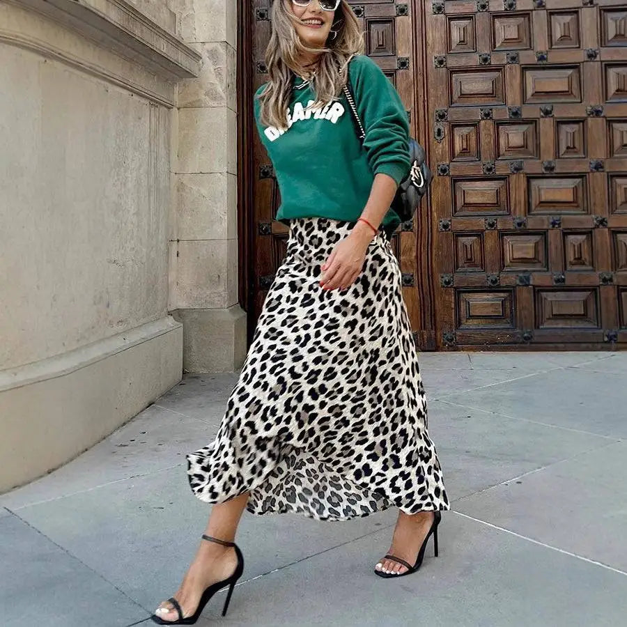 A black and white leopard print elastic a line skirt with lightweight fabric and a flowing flared hem