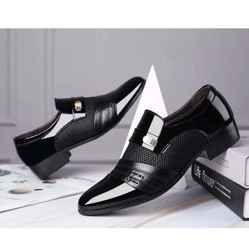 Black and white mesh patent leather shoes featuring black and white patent leather with gold-tone buckle accents