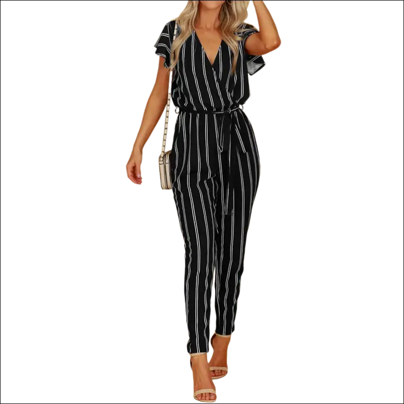 Black and white striped jumpsuit with vertical striped pattern, short flutter sleeves, self-tie waist, and backless design