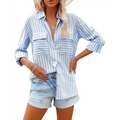 Light blue and white vertical stripe shirt with chest pockets for luxury women’s fashion wardrobe