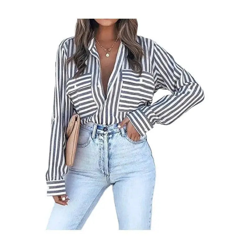 Black and white vertical stripe shirt with long sleeves chest pockets perfect for luxury women’s fashion attire
