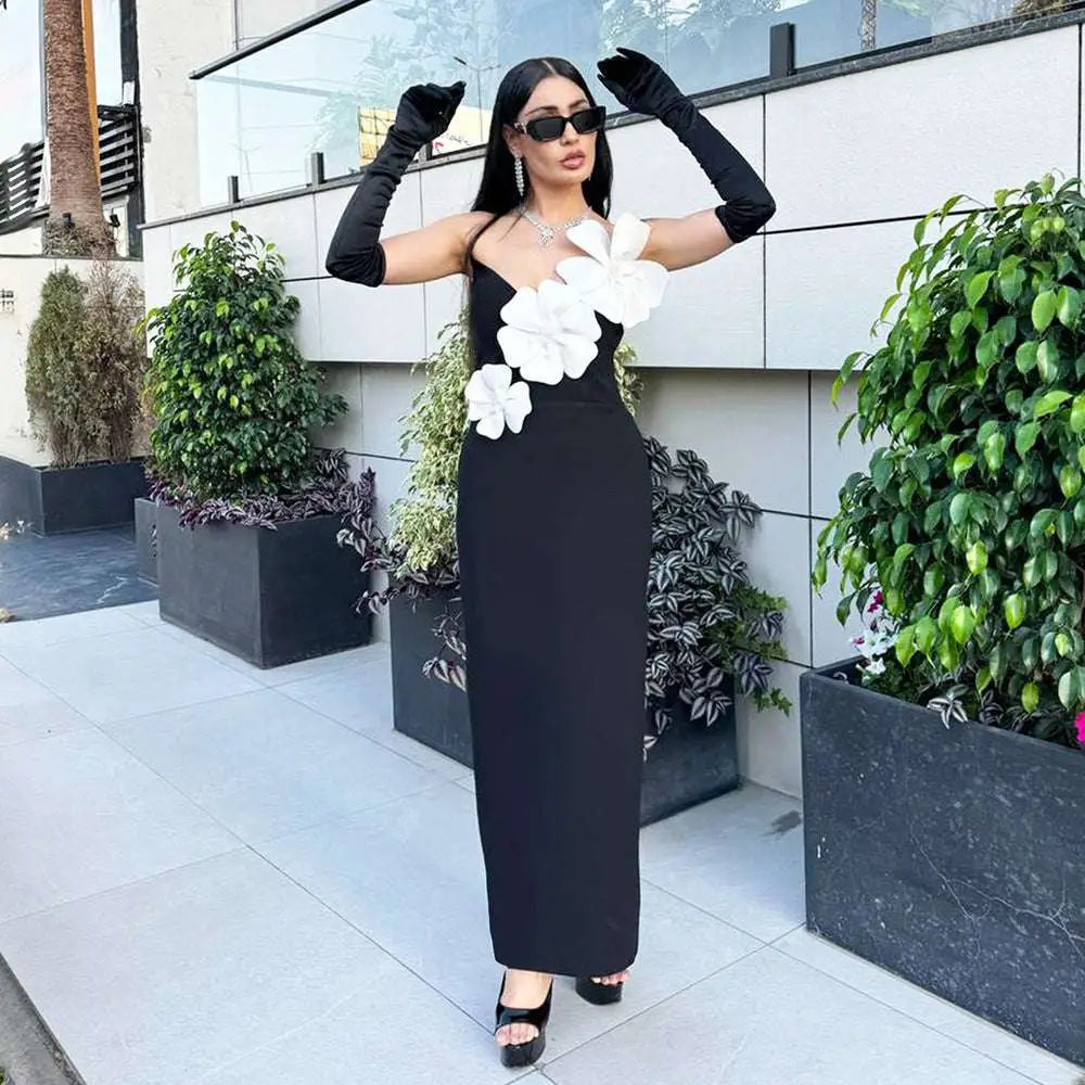 Black backless bandage gown featuring a strapless bandage chest with large white floral appliqués detailing