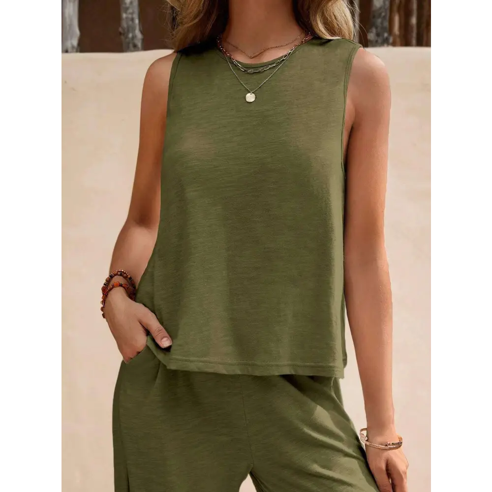 Olive green sleeveless top with relaxed fit and subtle texture paired with black casual loose pants set for comfortable everyday wear