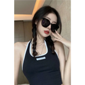 Black contrast trim halter neck sleeveless top with a small rectangular label at the neckline for women