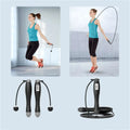 Black cordless electronic skipping rope with ergonomic handles and digital display for skipping rope workouts