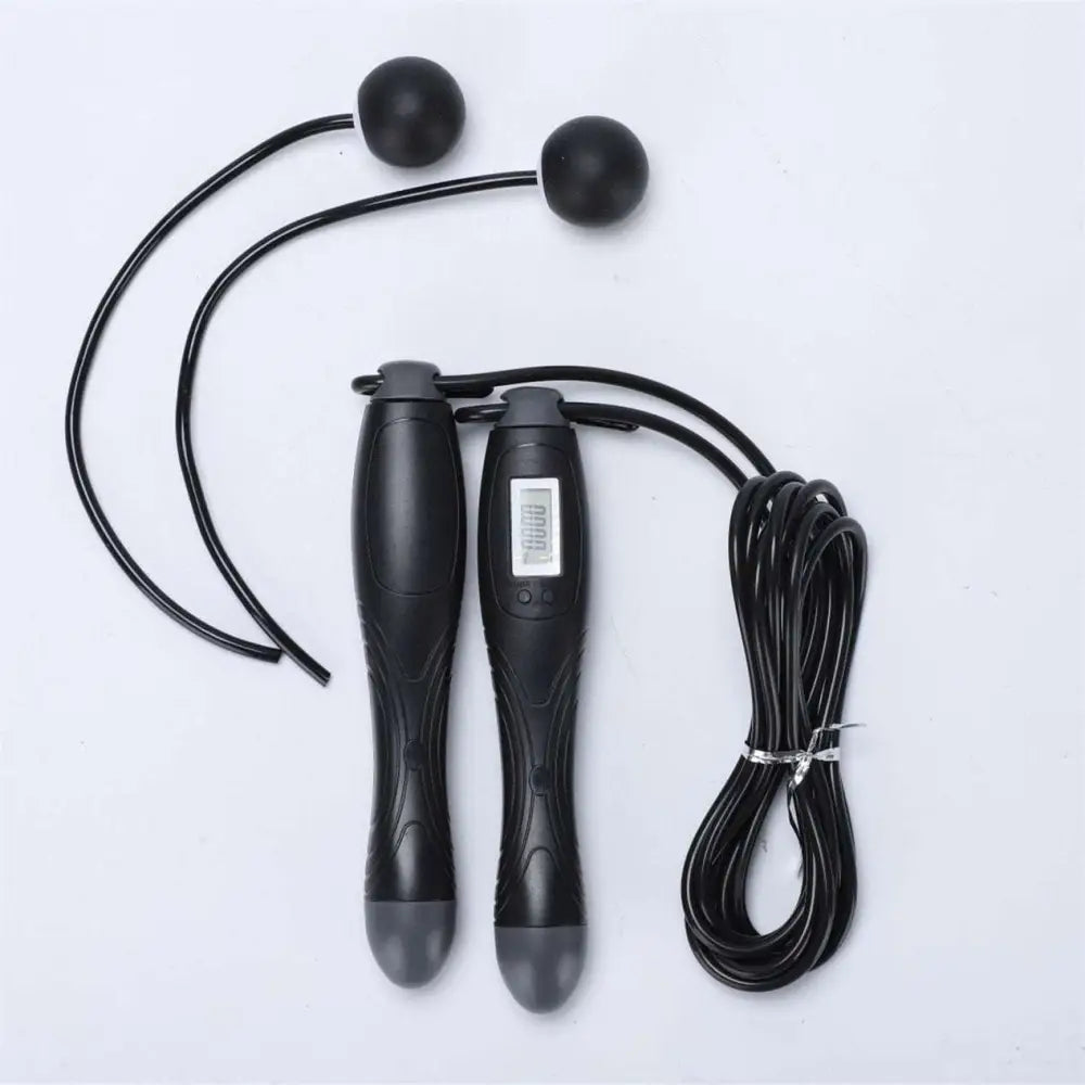 Black cordless electronic skipping rope with textured grips and spherical handles for skipping rope workouts