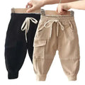Beige and black cotton cargo pants for boys with drawstring waistband and elastic cuffs in black corduroy cotton cargo style