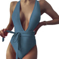 A sleek teal fashion pure color one-piece swimsuit with a deep v neck halter and tied waistband