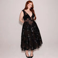 Black deep v-neck lace mesh evening dress featuring a sheer bodice and floral patterned midi skirt